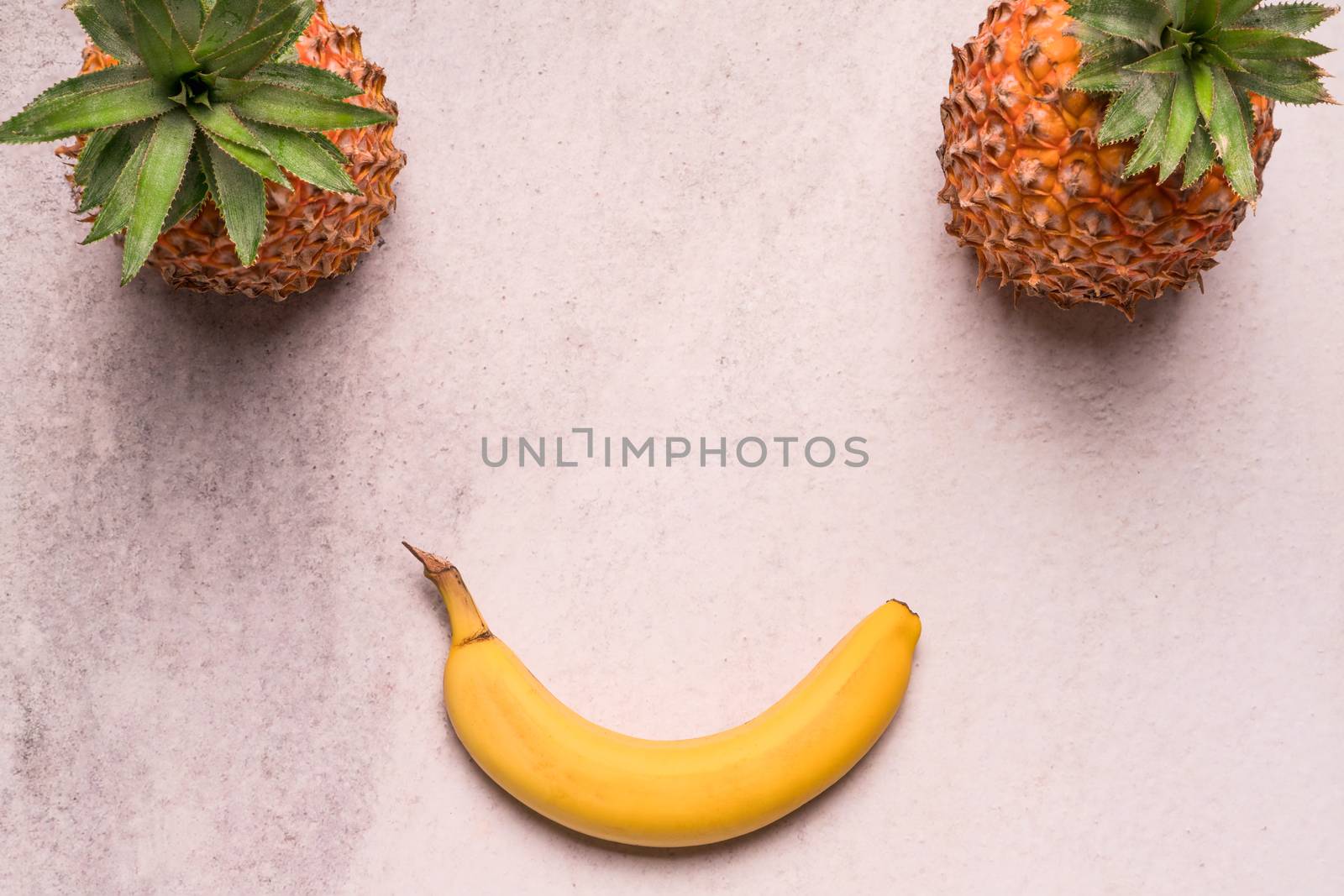 Tropical and Seasonal Summer Fruits. Pineapple and Bananas Arranged in smile face, Healthy Lifestyle. Flat Lay