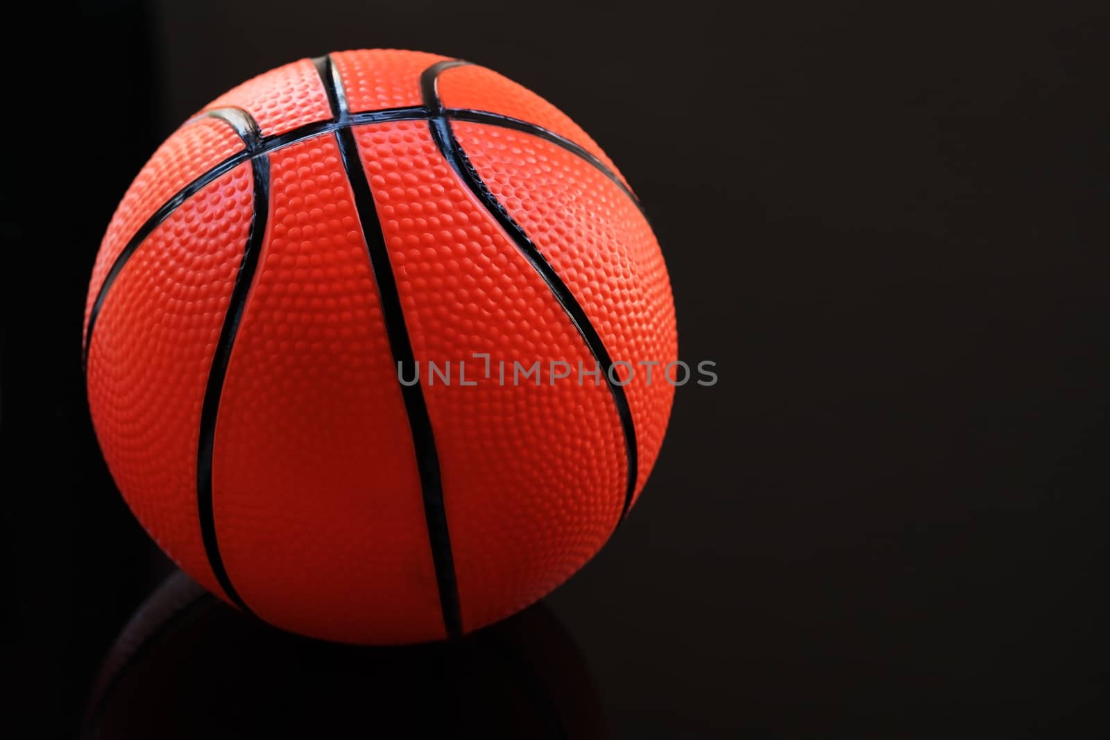 Basketball on a black background as a sports and fitness activit by psodaz