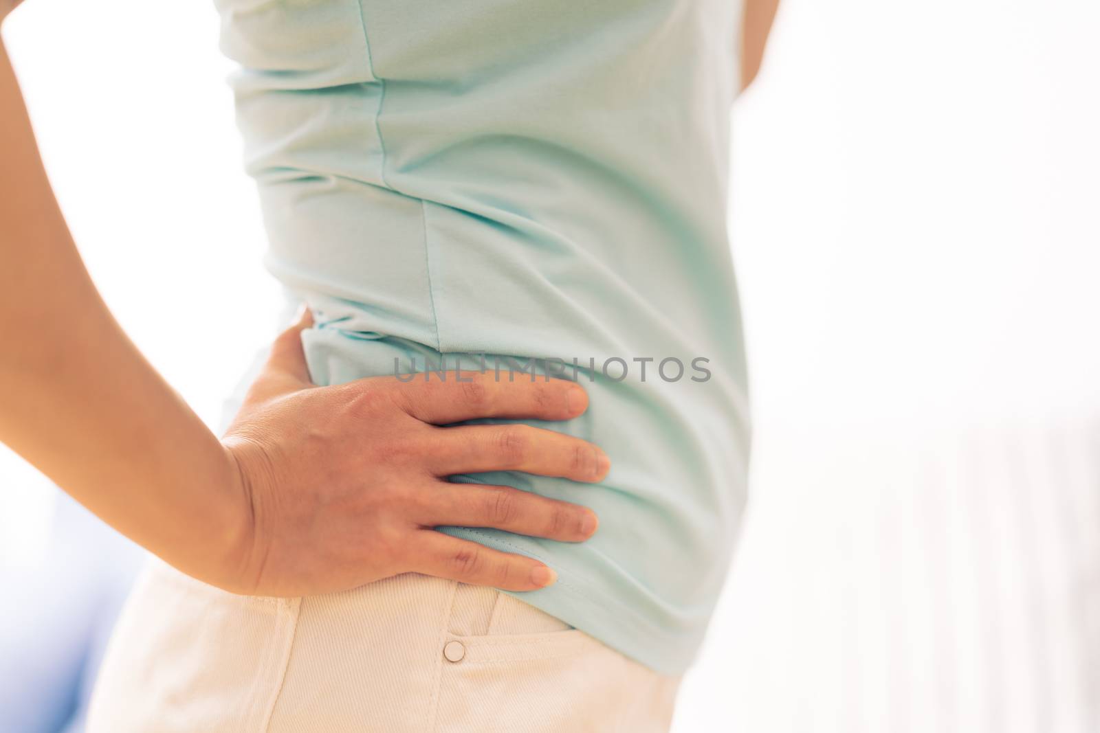 back pain at home. women suffer from backache. healthcare and medical concept