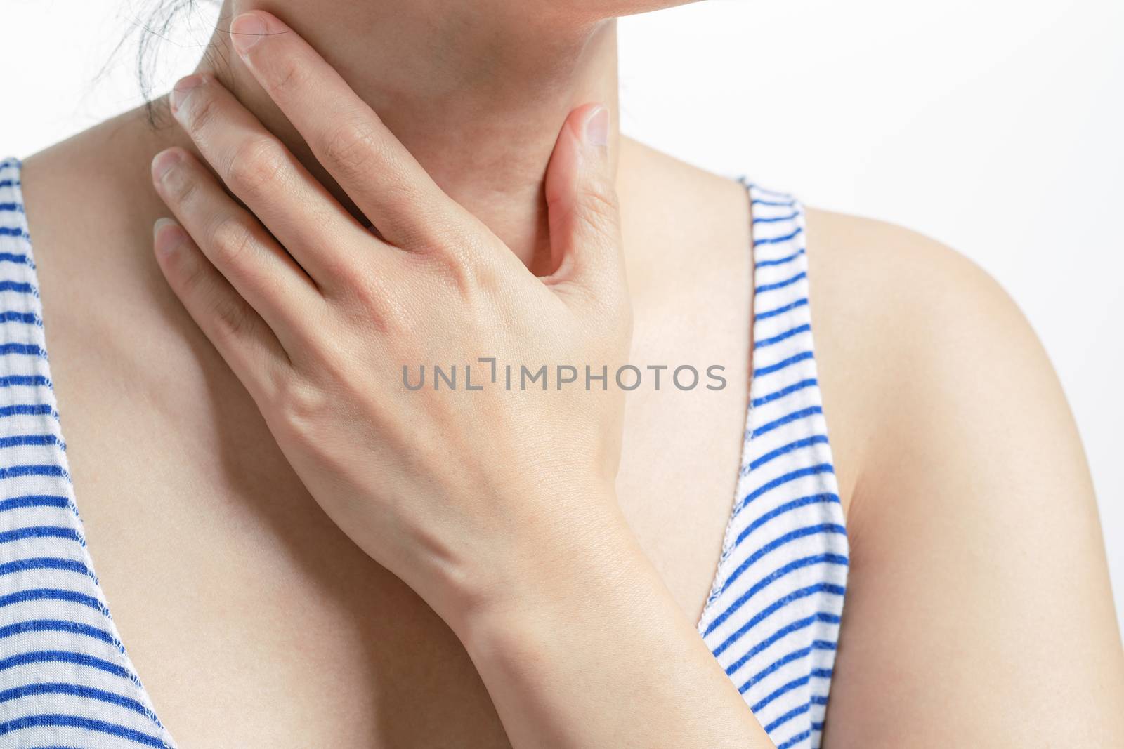 Sore throat pain women. Woman hand touching neck with sore throa by psodaz