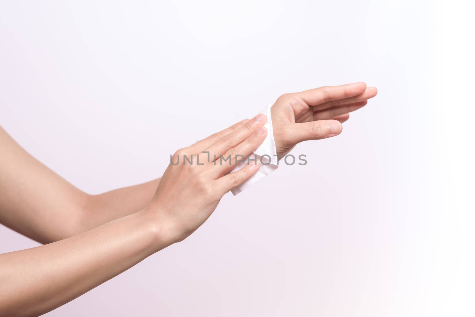Woman cleaning her hands with white soft tissue paper. isolated  by psodaz