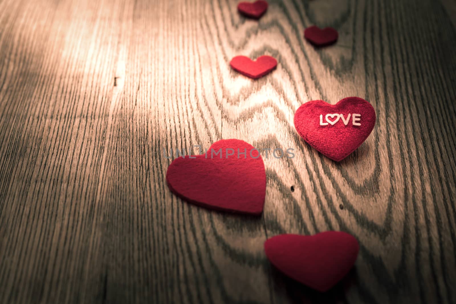 LOVE word on red heart on the wooden table backgrounds with copy by psodaz