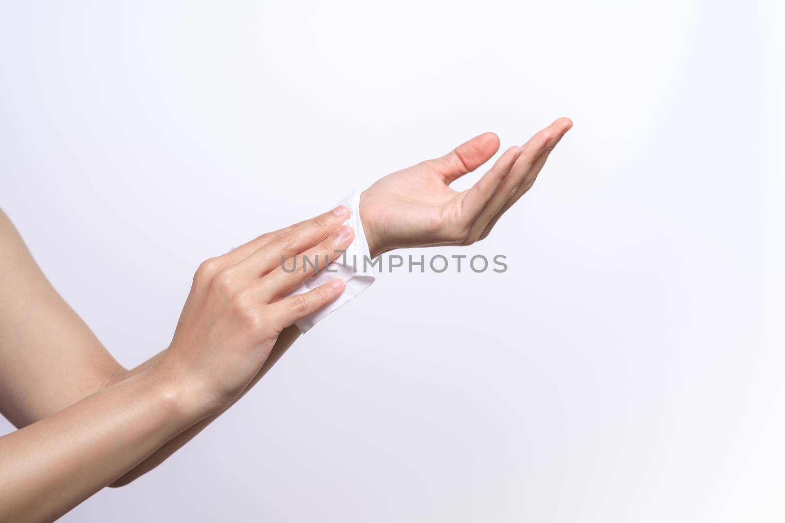 Woman cleaning her hands with white soft tissue paper. isolated on a white backgrounds