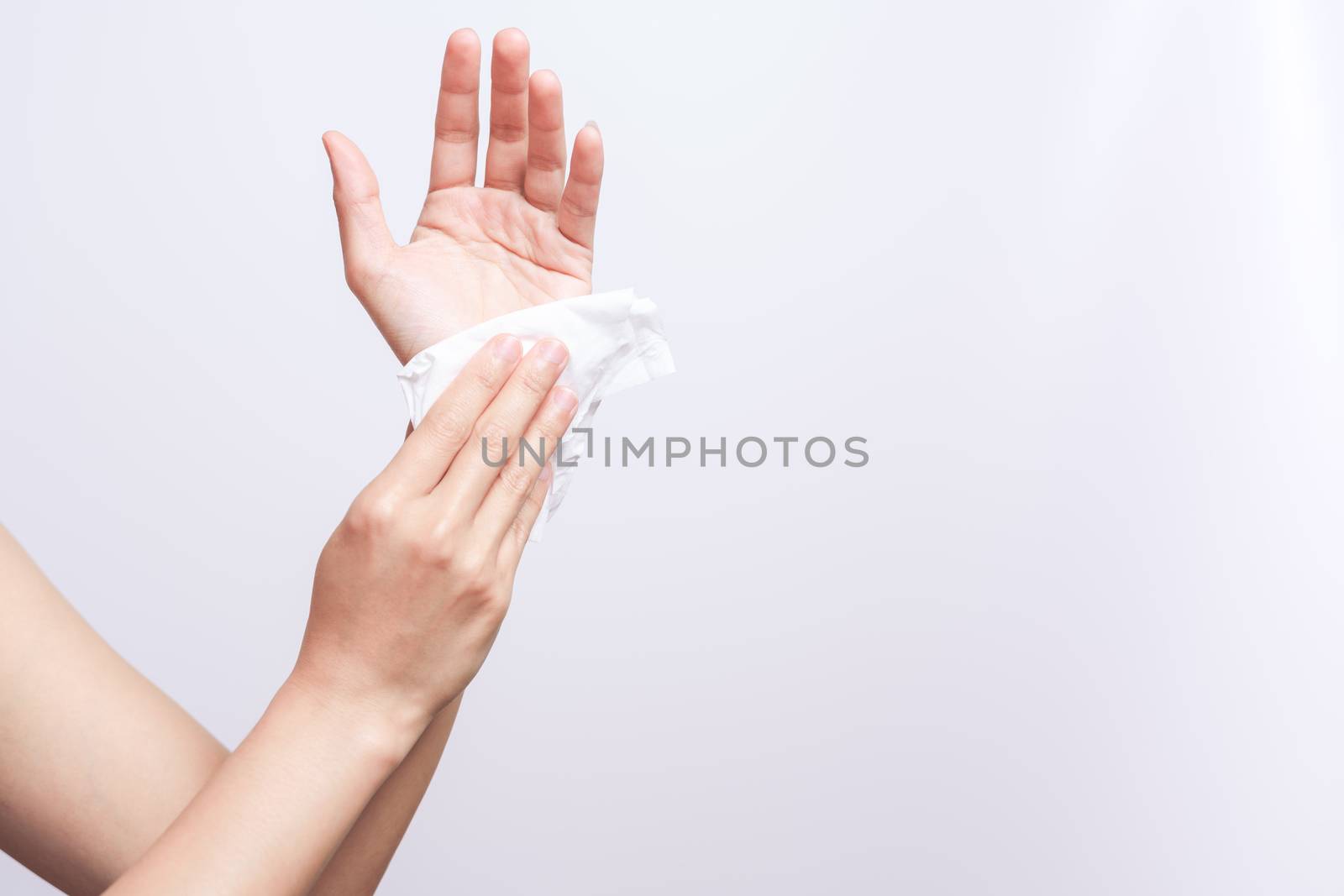 Woman cleaning her hands with white soft tissue paper. isolated  by psodaz