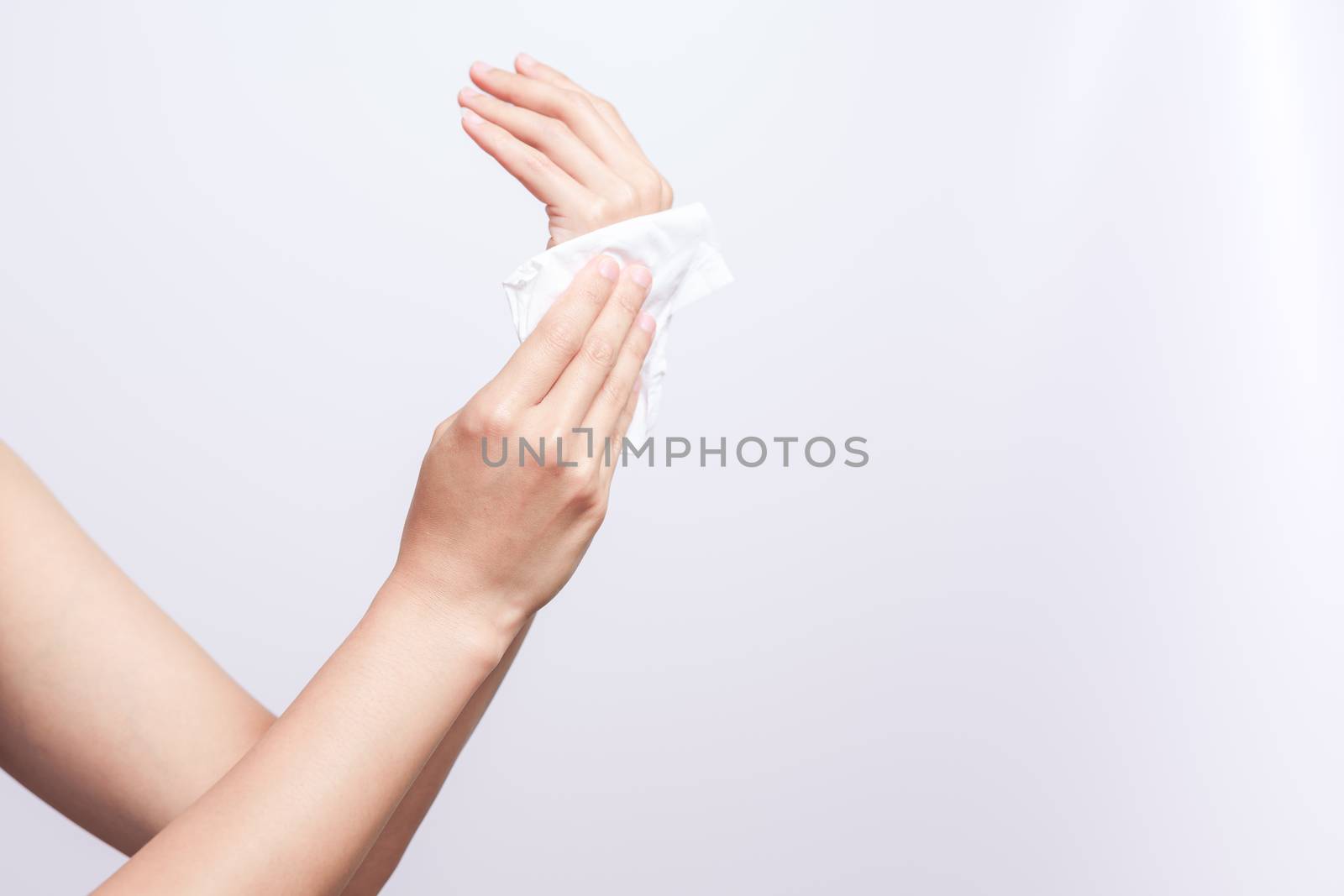 Woman cleaning her hands with white soft tissue paper. isolated  by psodaz