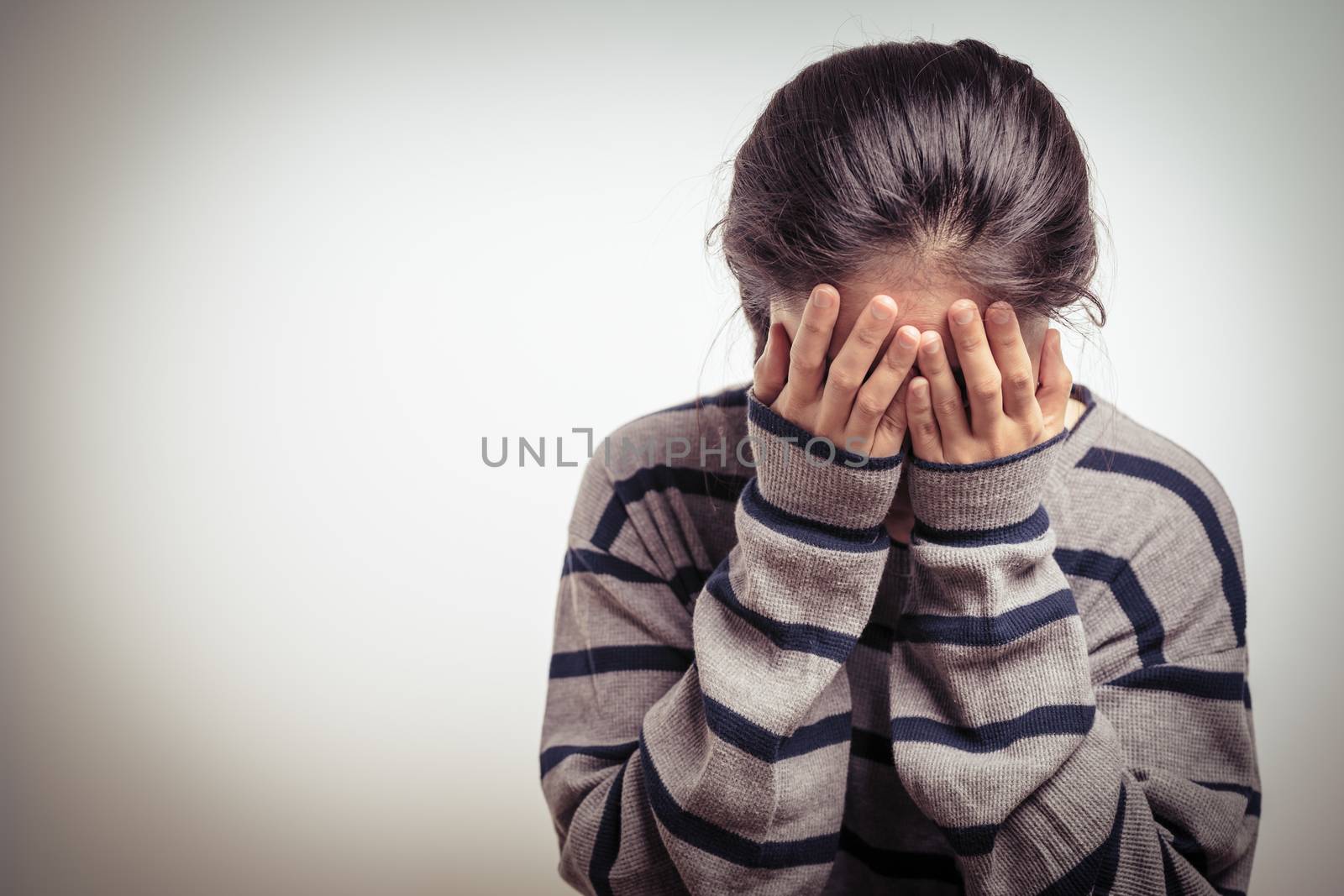 depressed women sitting in the dark room, alone, sadness, emotio by psodaz