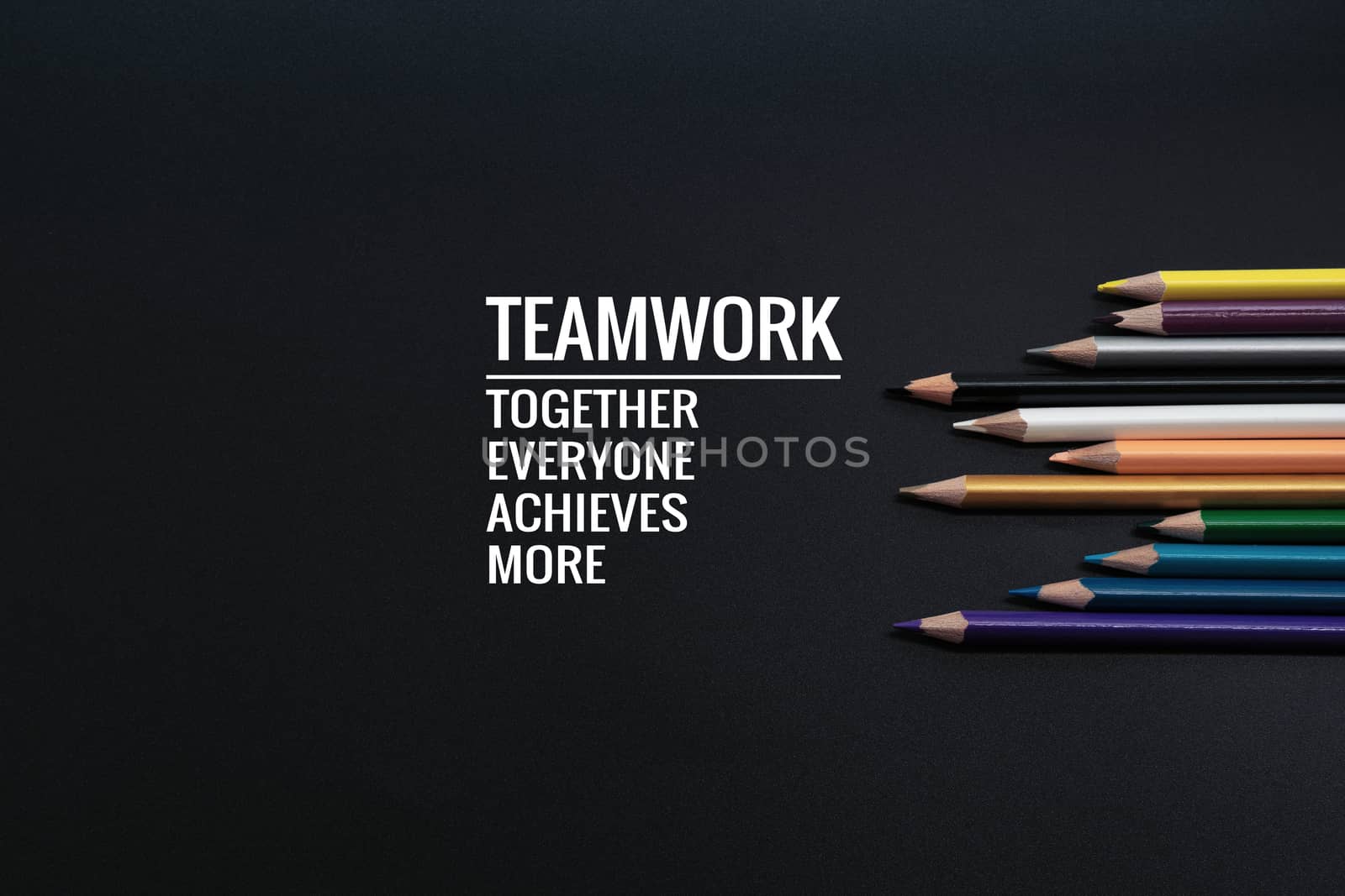 Teamwork concept. group of color pencil on black background with by psodaz