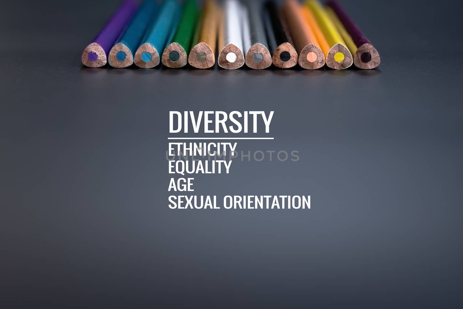 Diversity concept. row of mix color pencil on black background with text Diversity, Ethnicity, Equality, Age, Sexual Orientation