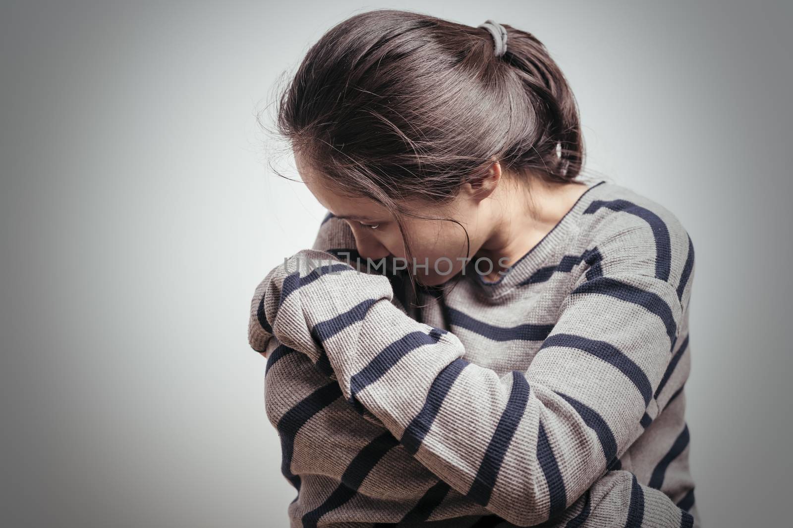 depressed women sitting in the dark room, alone, sadness, emotional concept