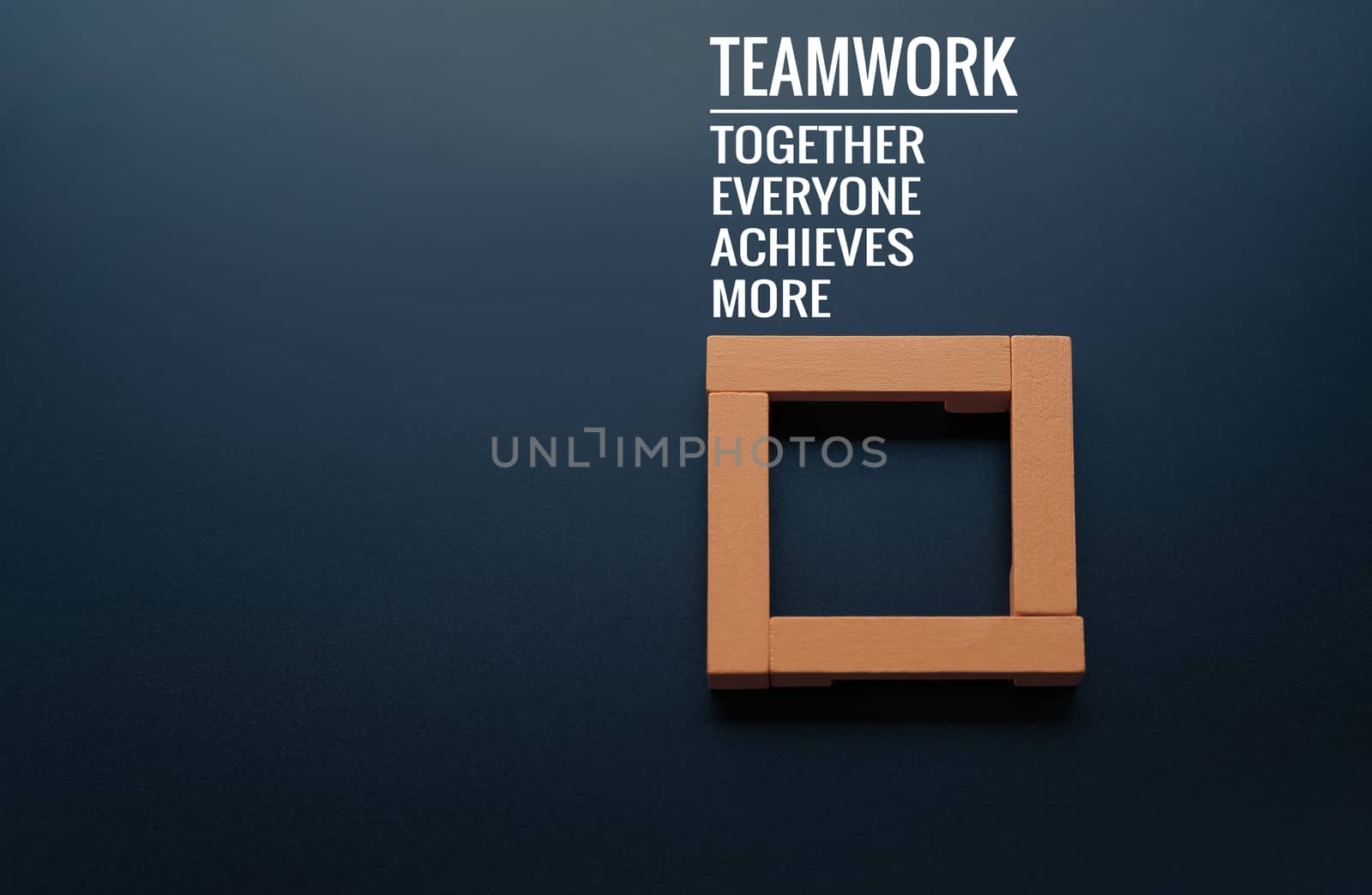 Teamwork concept. group of wooden square on the black backgrounds with word Teamwork, Together, Everyone, Achieves and More