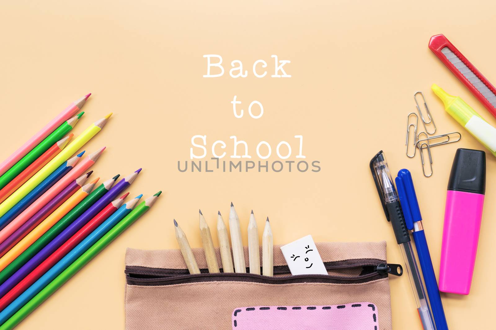Welcome back to school background, colorful color pencil and stationery bag on yellow backgrounds with copy space