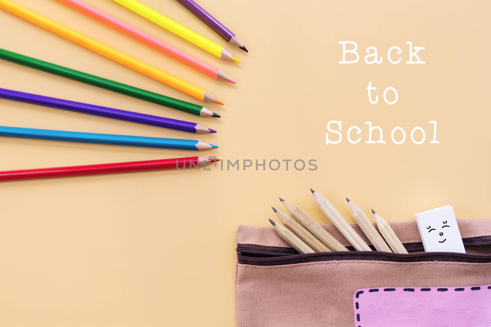 Welcome back to school background, colorful color pencil and stationery bag on yellow backgrounds with copy space