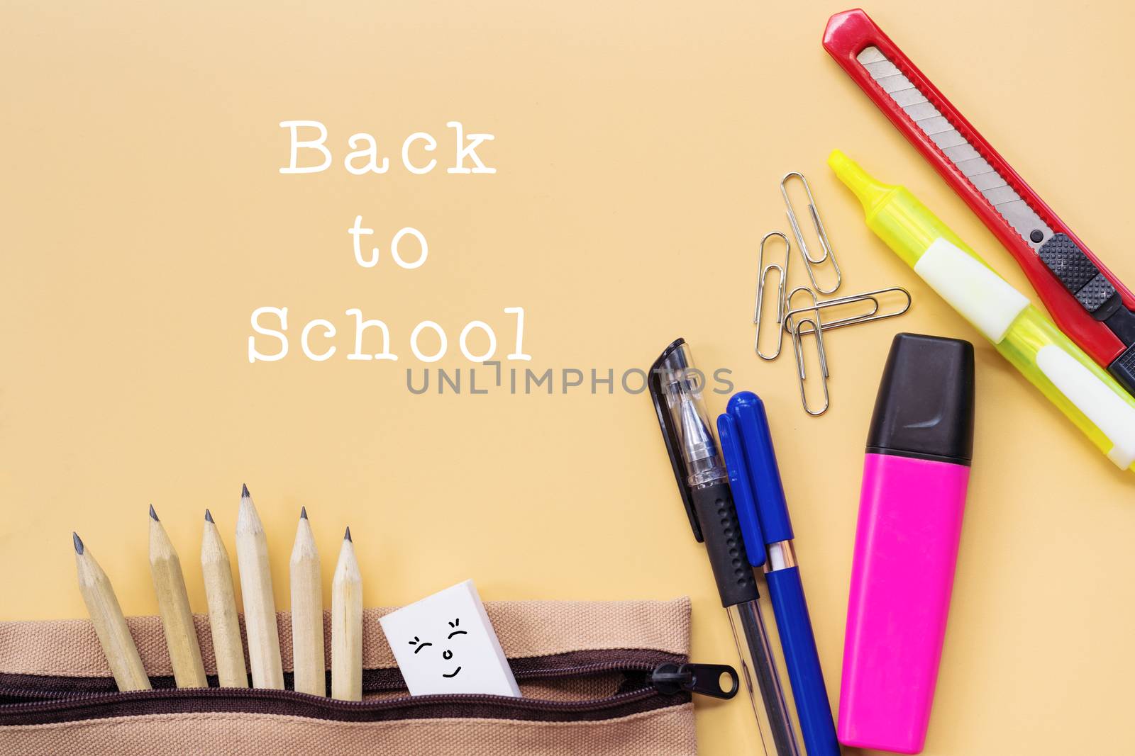 Welcome back to school background, colorful color pencil and stationery bag on yellow backgrounds with copy space