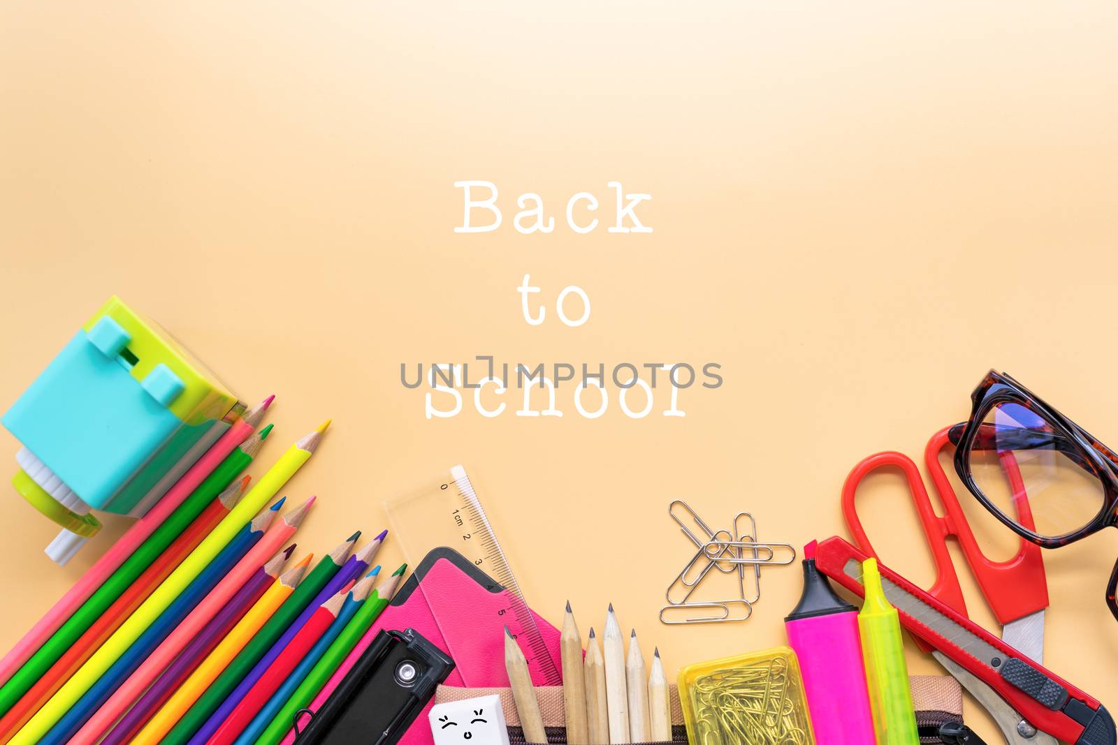 Welcome back to school background, colorful color pencil and stationery bag on yellow backgrounds with copy space