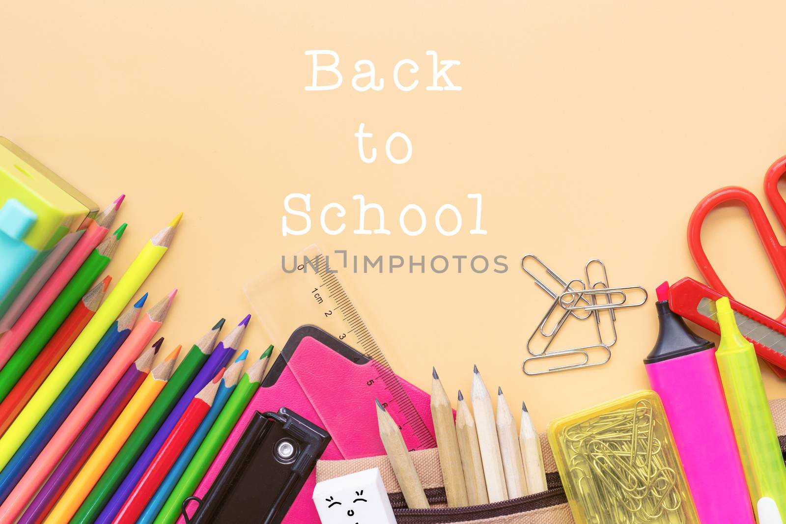 Welcome back to school background, colorful color pencil and stationery bag on yellow backgrounds with copy space