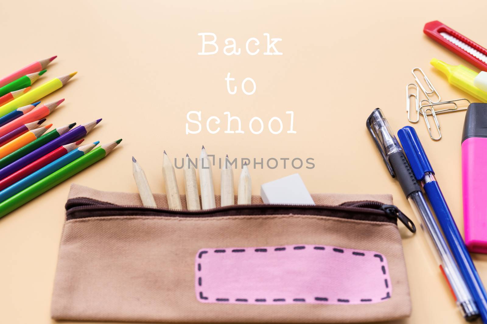 Welcome back to school background, colorful color pencil and stationery bag on yellow backgrounds with copy space