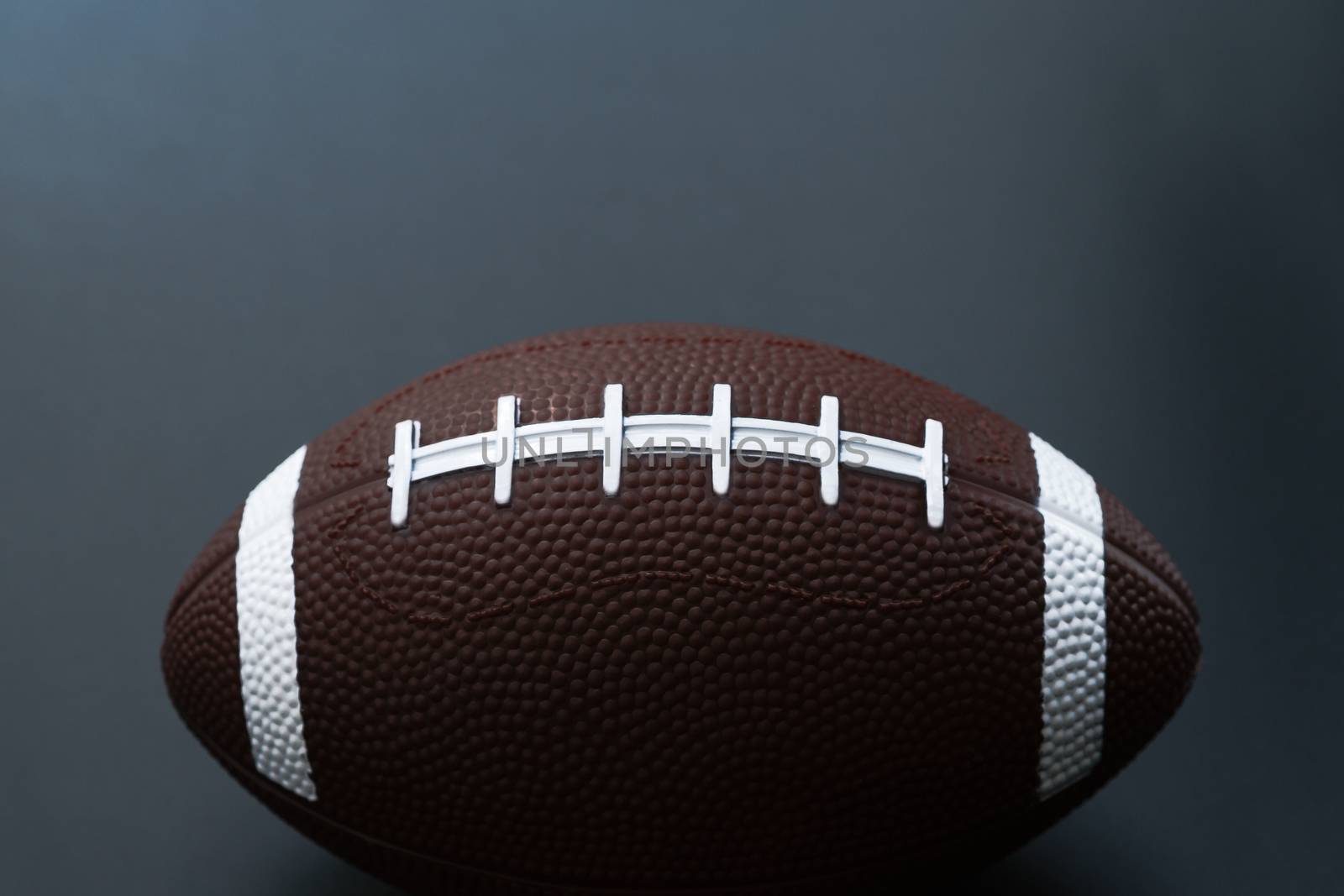 American football isolated on black background . Sport object concept