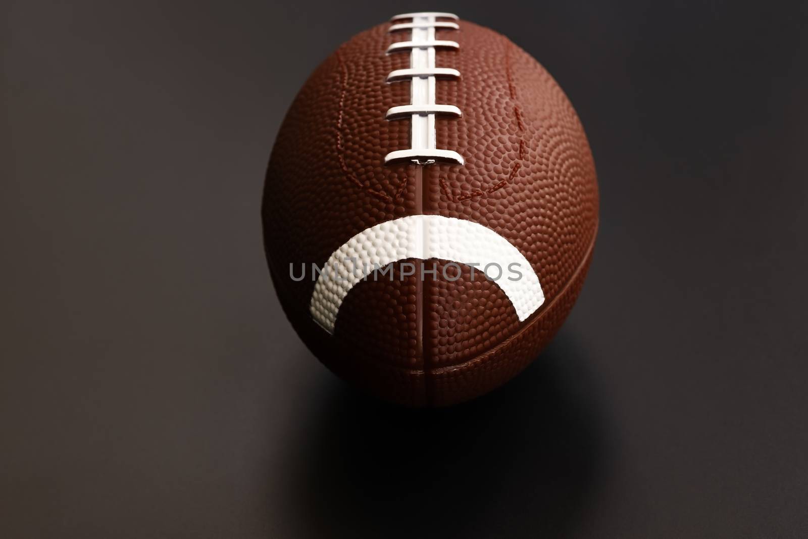 American football isolated on black background . Sport object concept