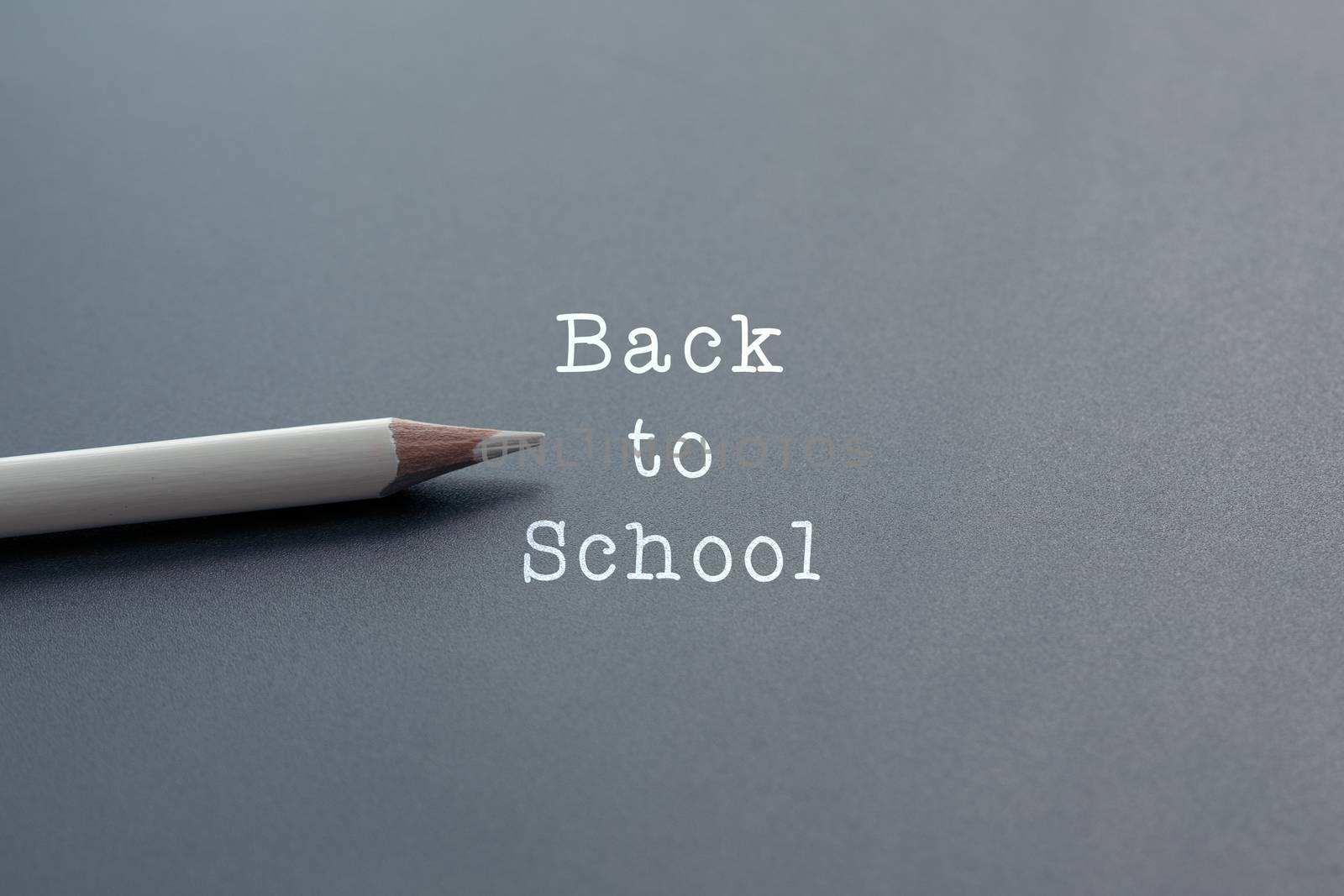 Welcome back to school background, white pencil on black backgrounds with copy space