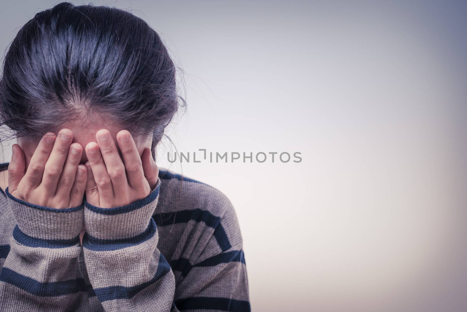 depressed women sitting in the dark room, alone, sadness, emotional concept