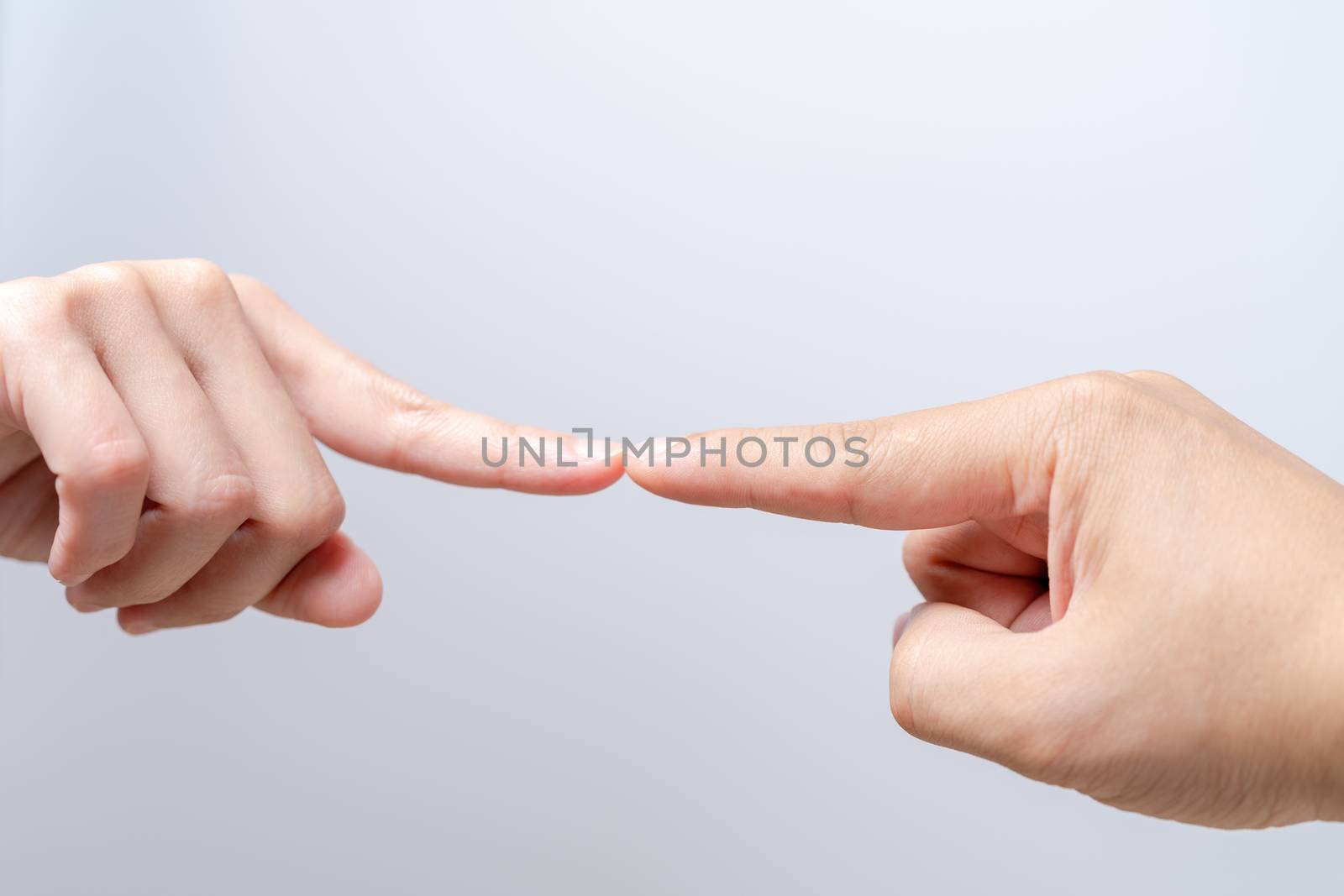 finger point touching men and women hands reaching towards each other. Diversity differential concept