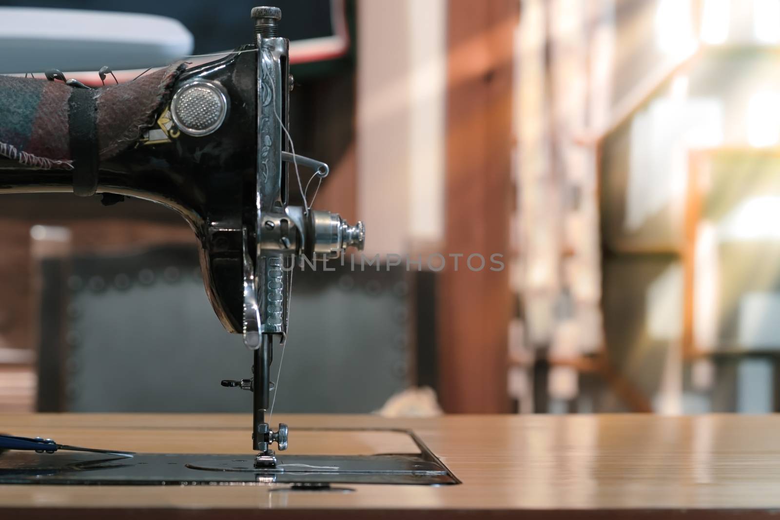 sewing machine with white fabric, vintage sewing machine style