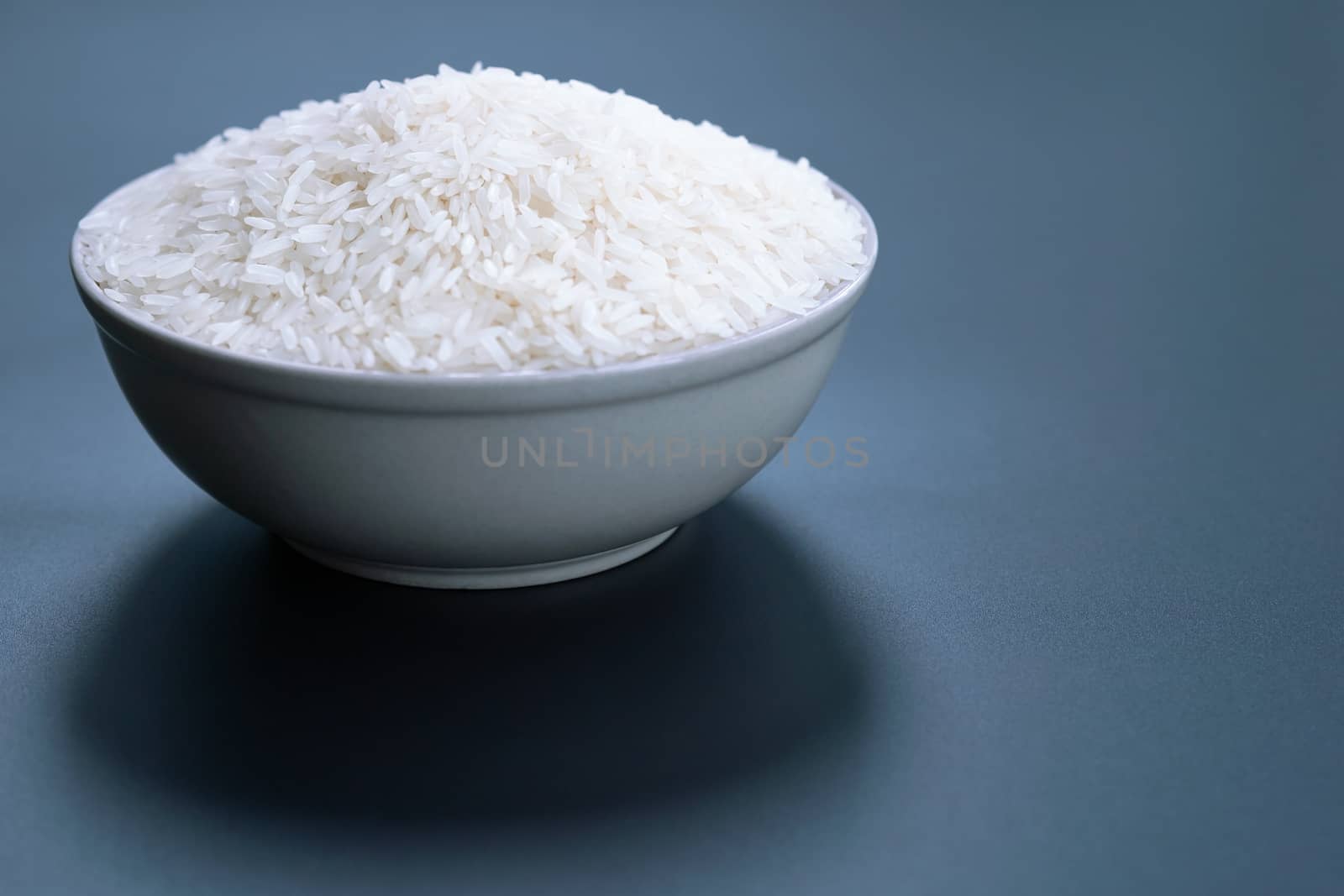 bowl of jasmine white rice on black backgrounds by psodaz