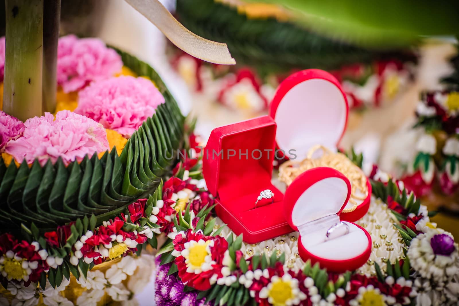 Dowry (gold necklace) on flower tray in Thai traditional wedding by psodaz