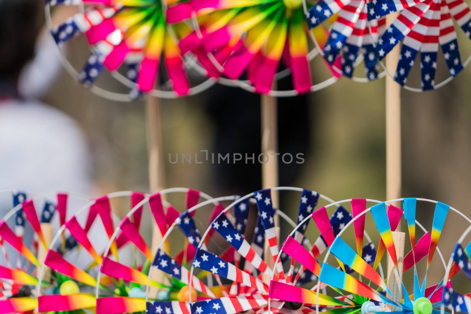 Close up the rainbow pinwheel toy, colorful turbines toy by psodaz