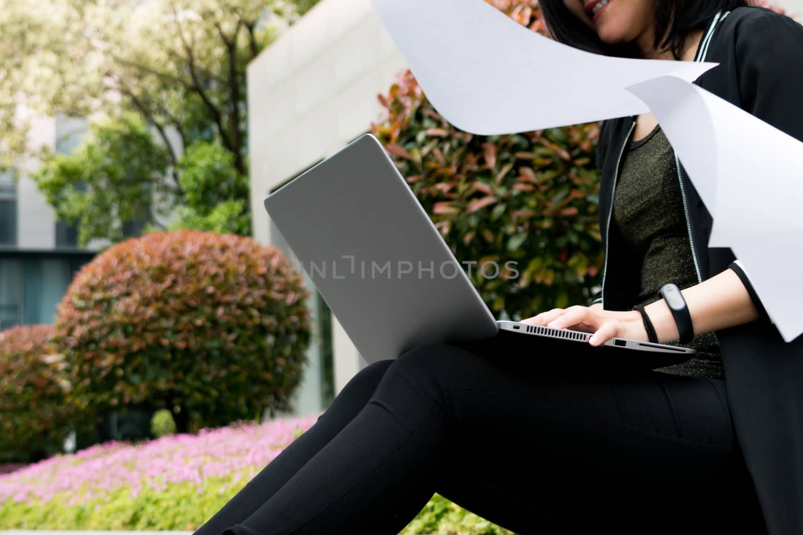 A student woman is surfing internet in laptop computer by psodaz