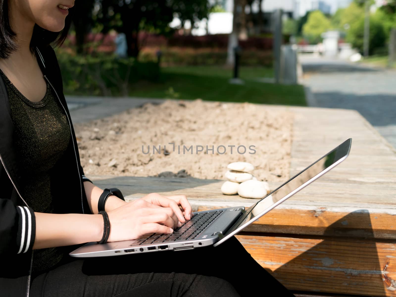 A student woman is surfing internet in laptop computer by psodaz