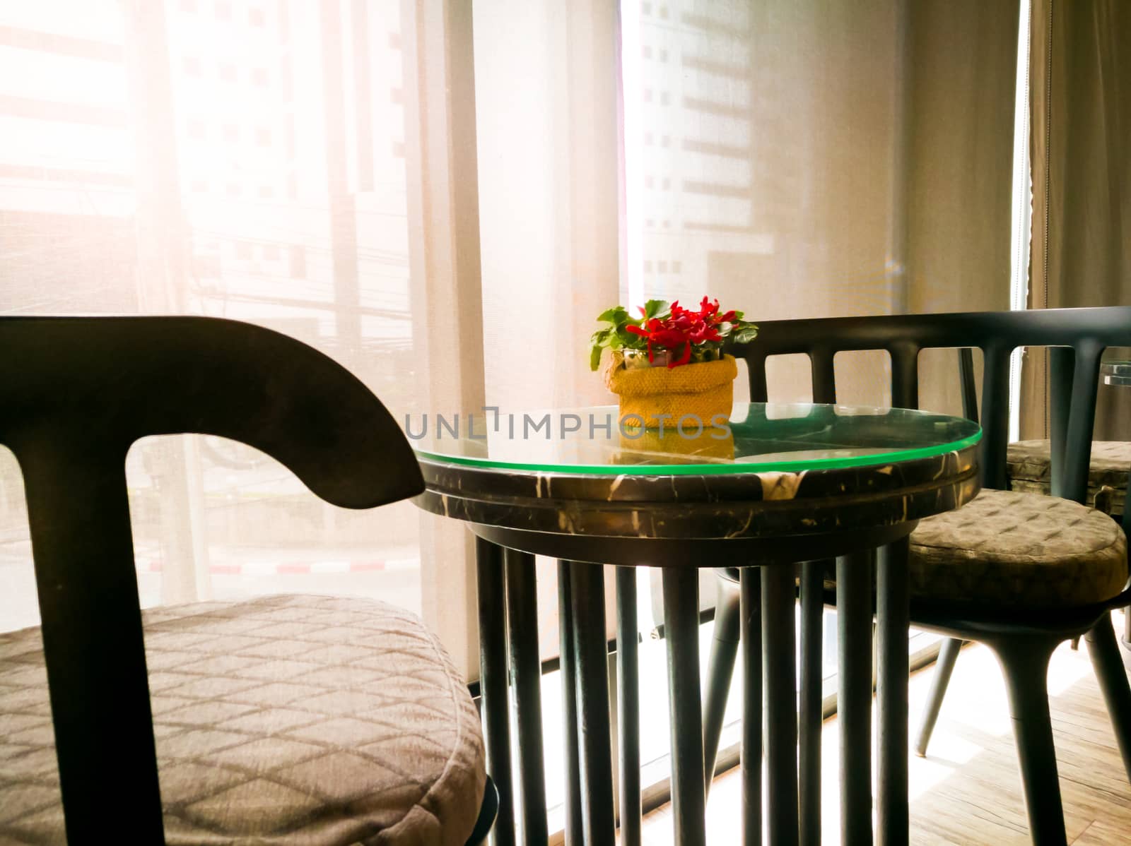 cozy wooden table with the red orchid