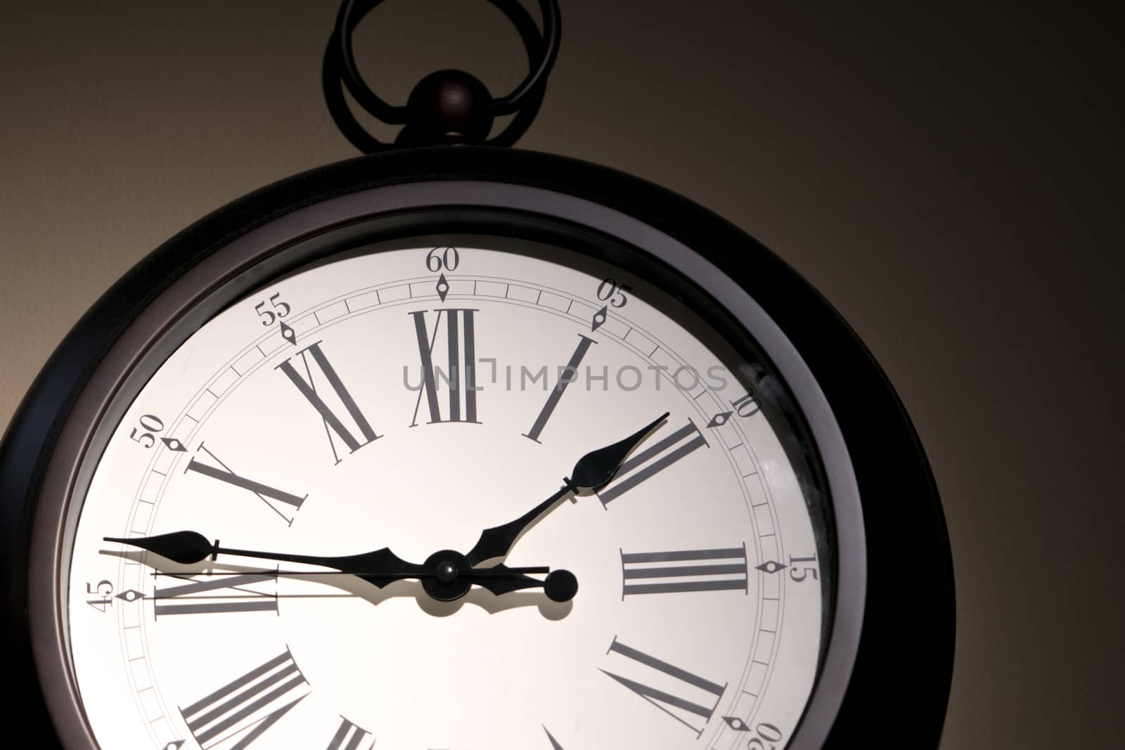 under exposure of vintage clock face on the wall