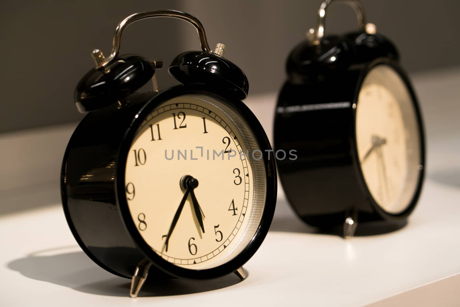 the alarm vintage clocks face on the table by psodaz