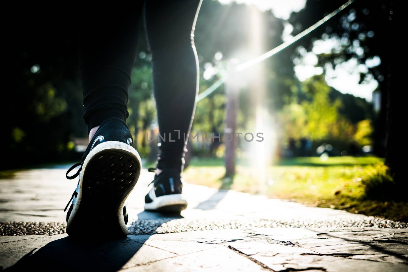 close up of girl shoe while walking in the park, walk for life c by psodaz