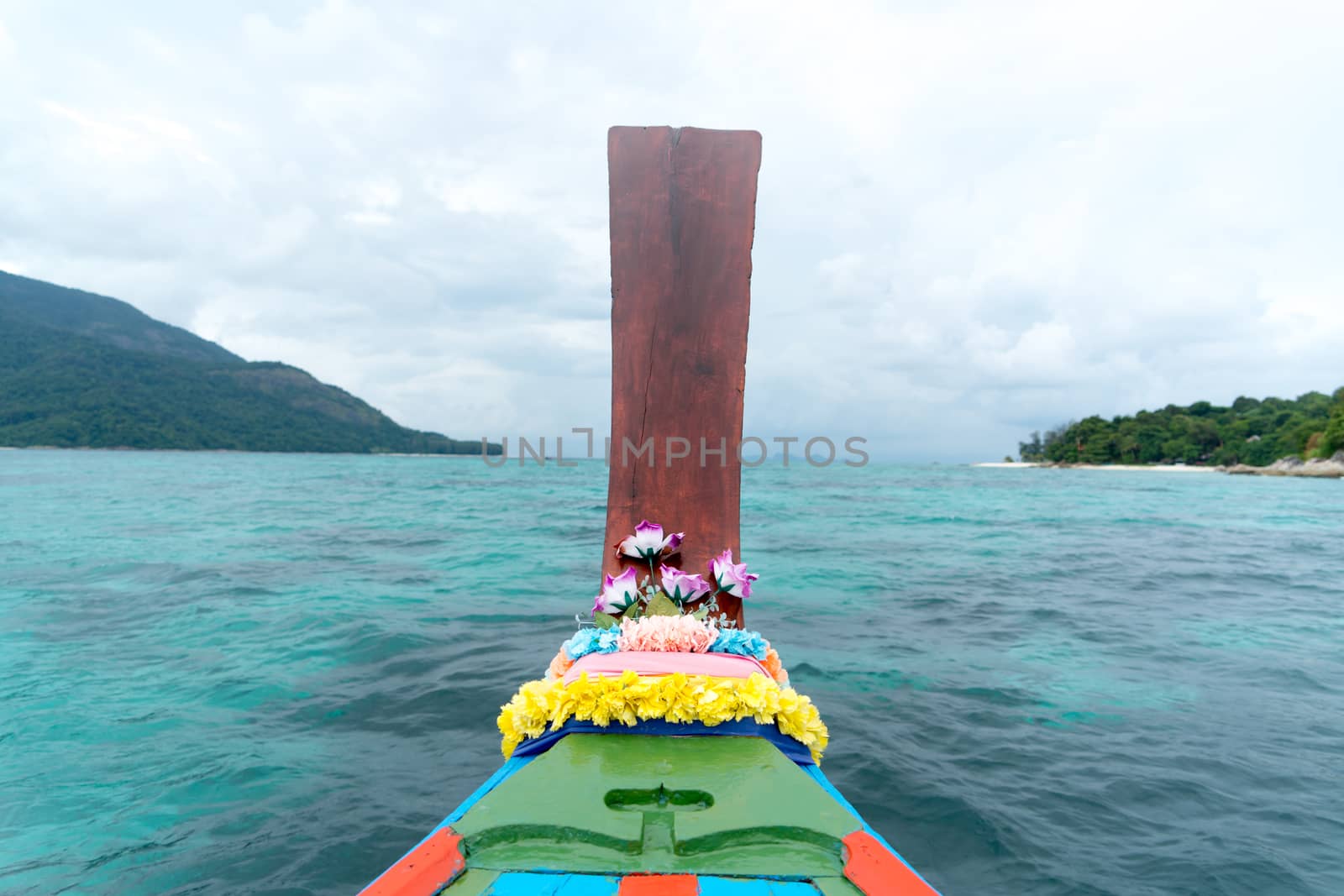 long tailed boat, fishing boat, motor boat on the blue sea