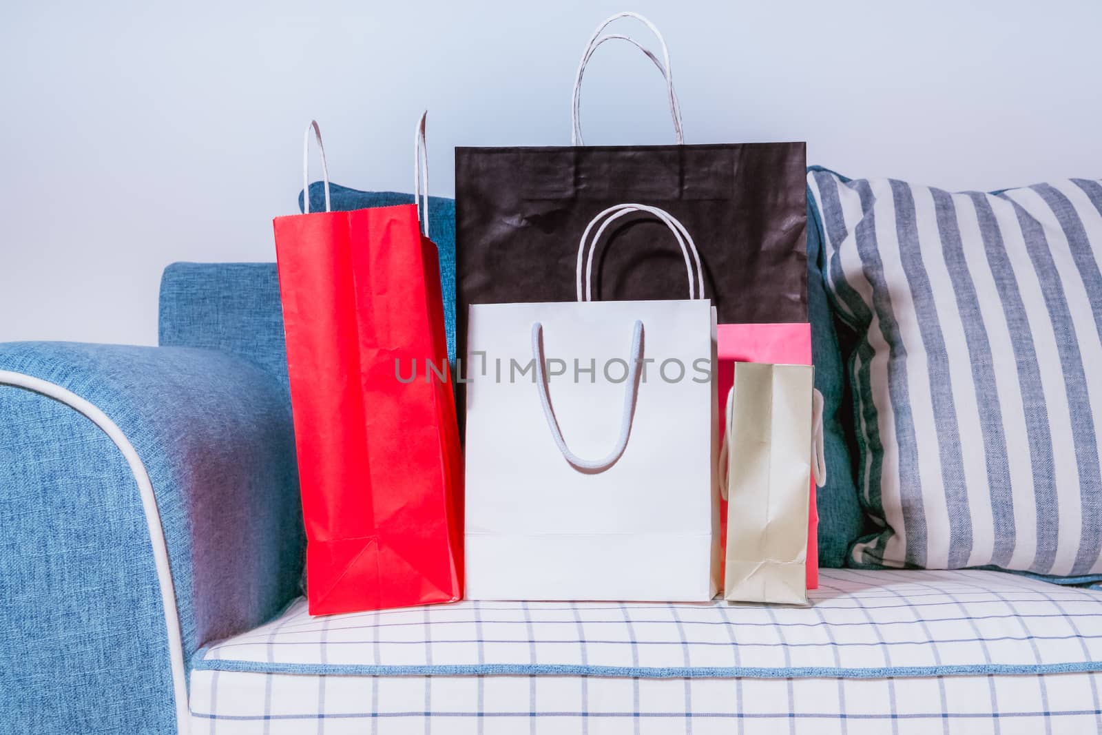 the shopping bags are on the sofa, gift and celebration by psodaz