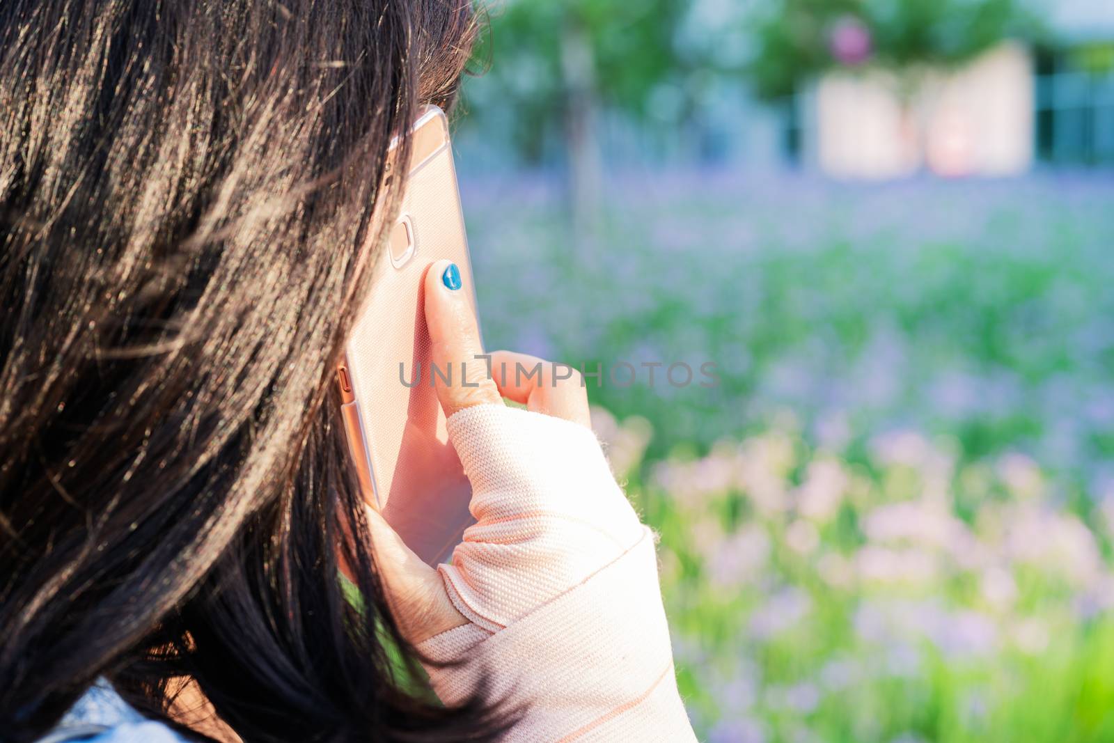 young student women calling on smartphone while wrist hand pain. modern lifestyle concept