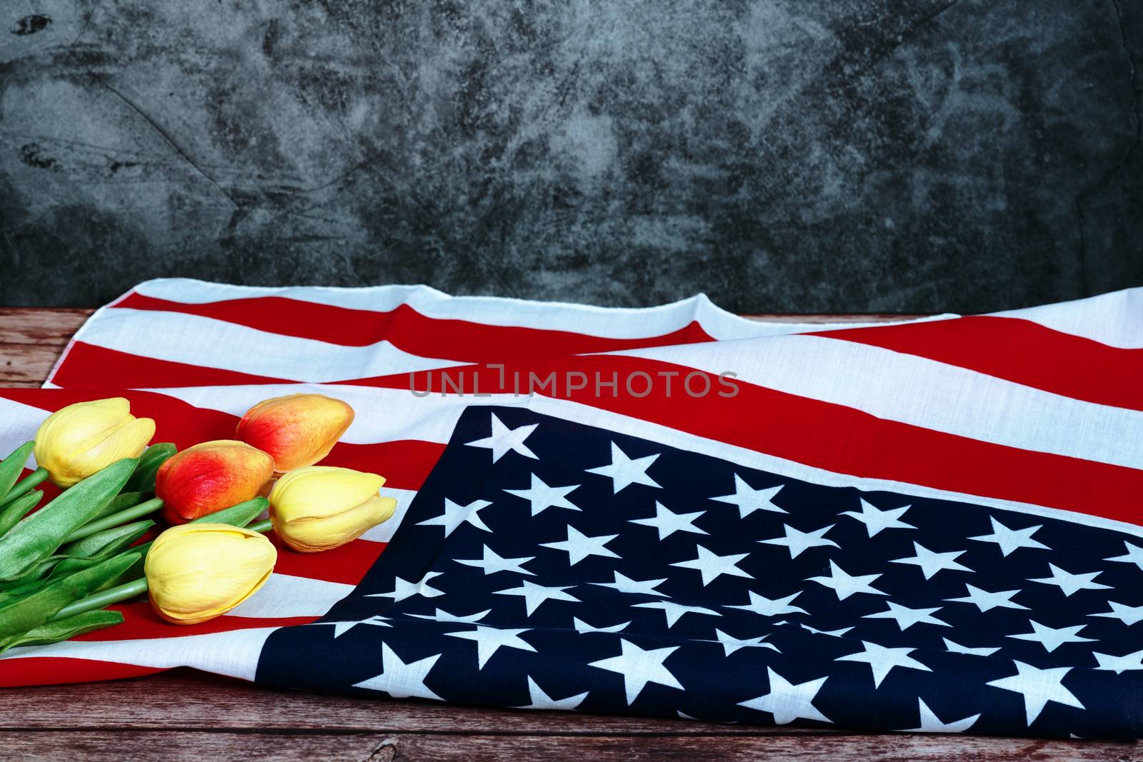 Memorial Day with American flag and flower on wooden background