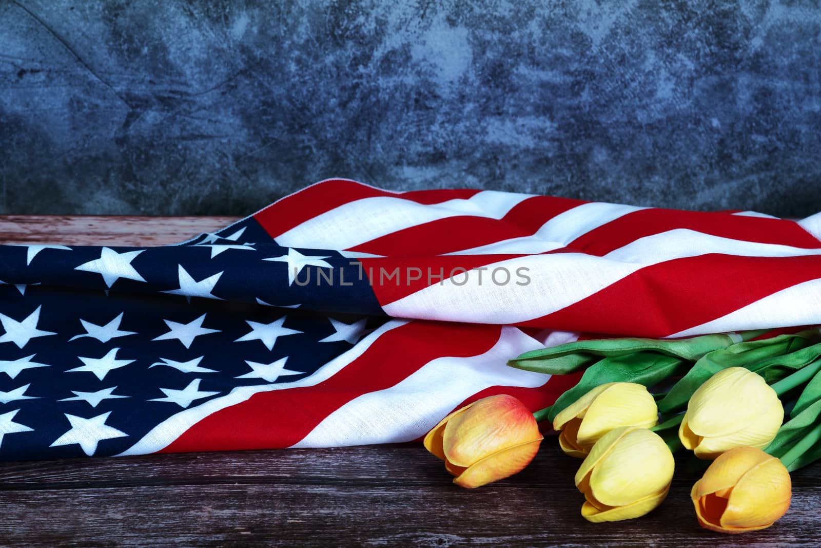 Memorial Day with American flag and flower on wooden background