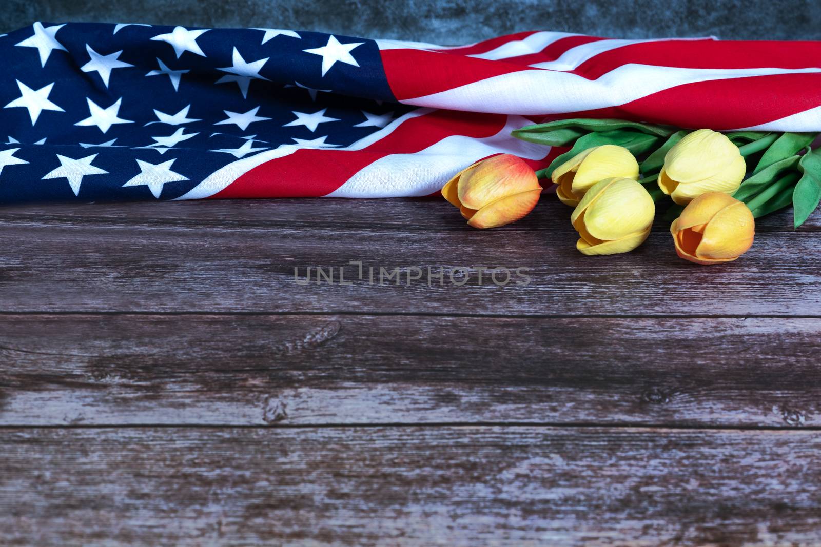 Memorial Day with American flag and flower on wooden background