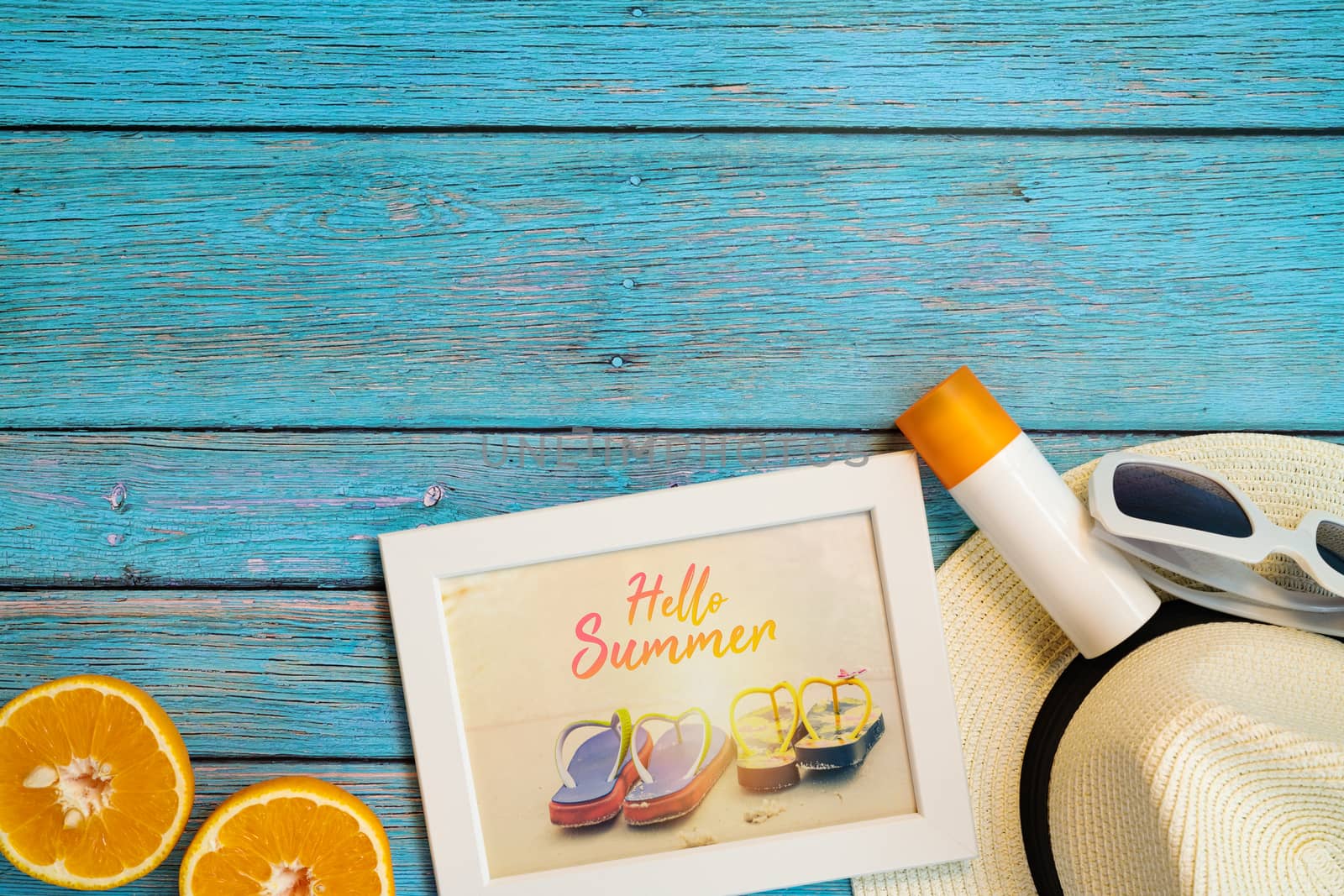 Beautiful summer holiday, Beach accessories, orange, sunglasses, hat and sunblock on wooden backgrounds