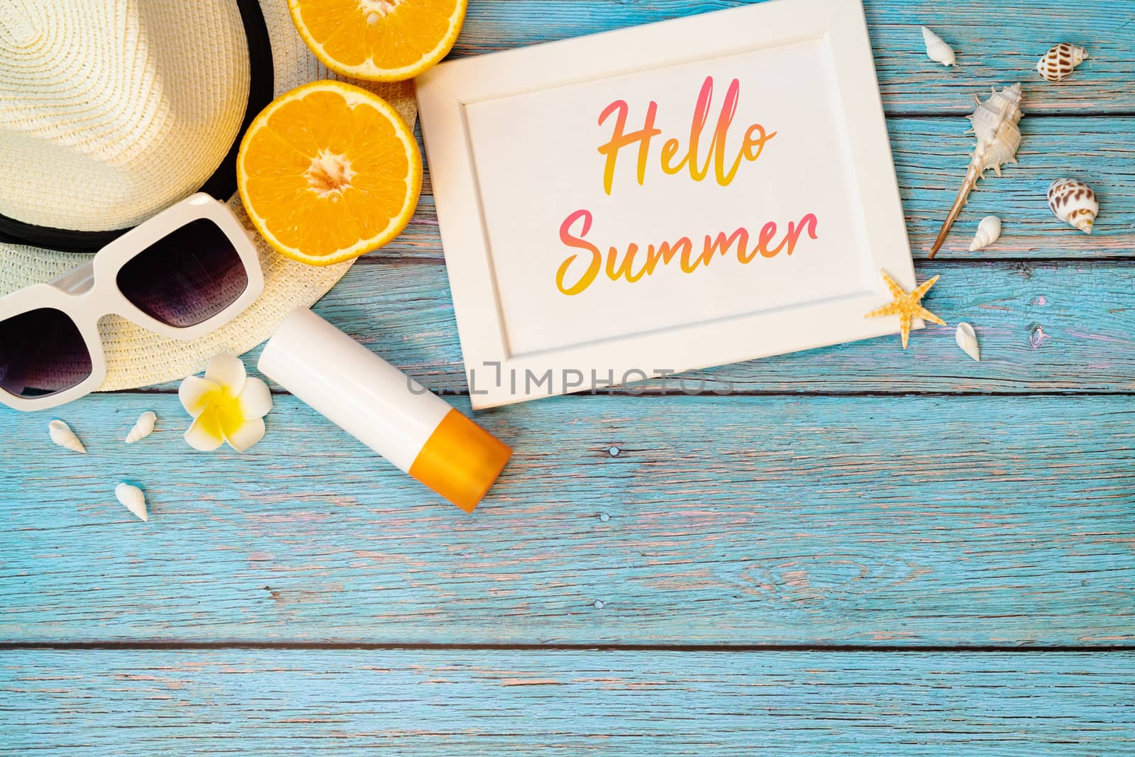 Beautiful summer holiday, Beach accessories, orange, sunglasses, hat and sunblock on wooden backgrounds