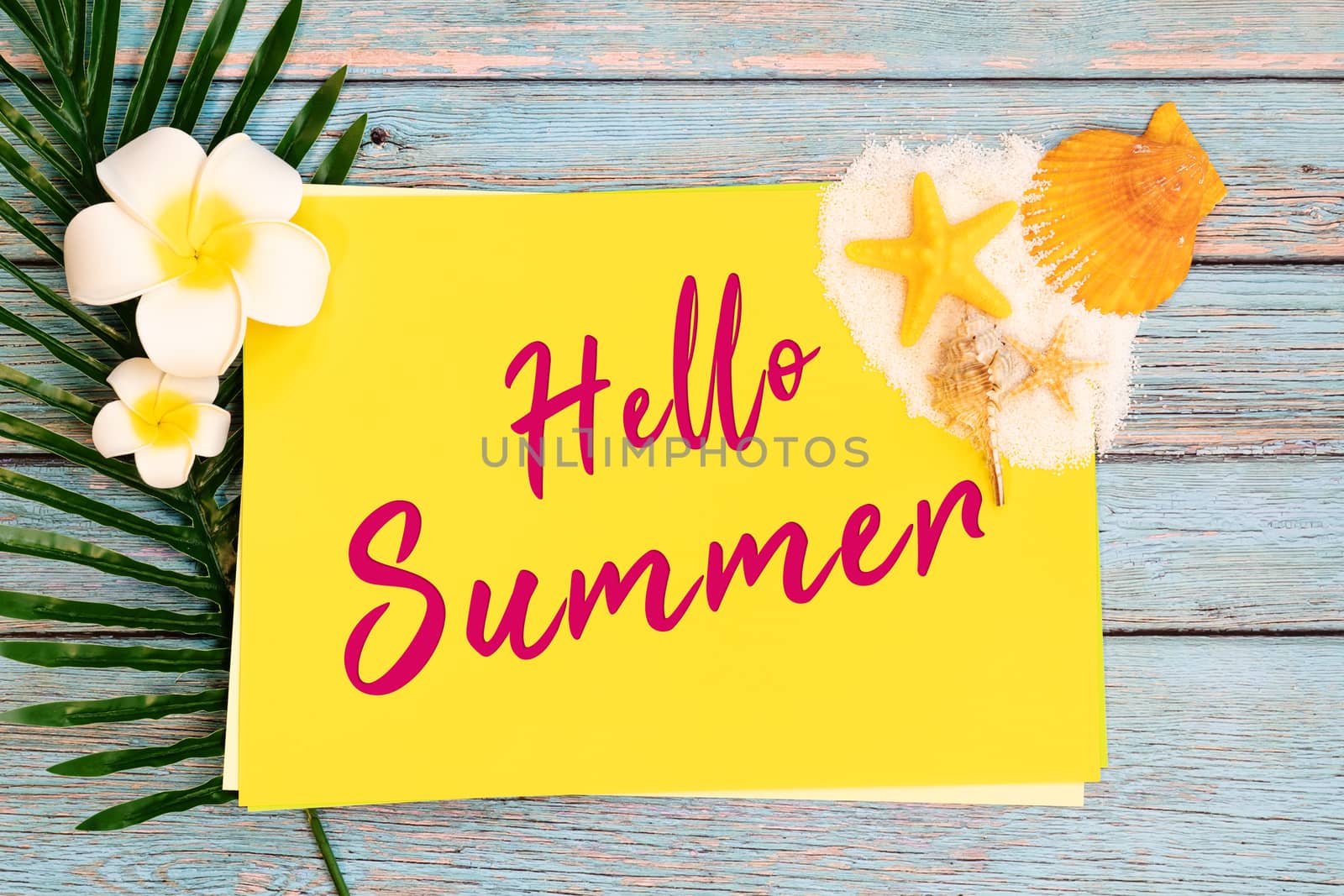 Beautiful summer holiday, Beach accessories, seashells, sand and palm leave on paper for copy space