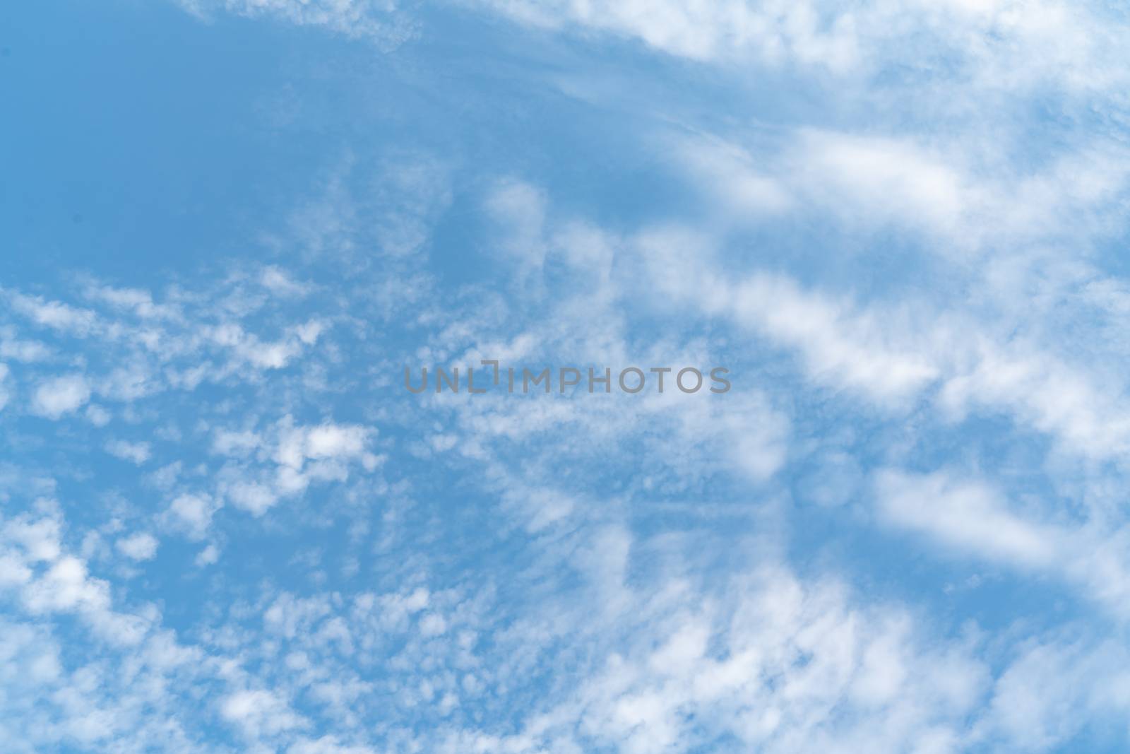 white soft cloud texture on blue sky backdrop