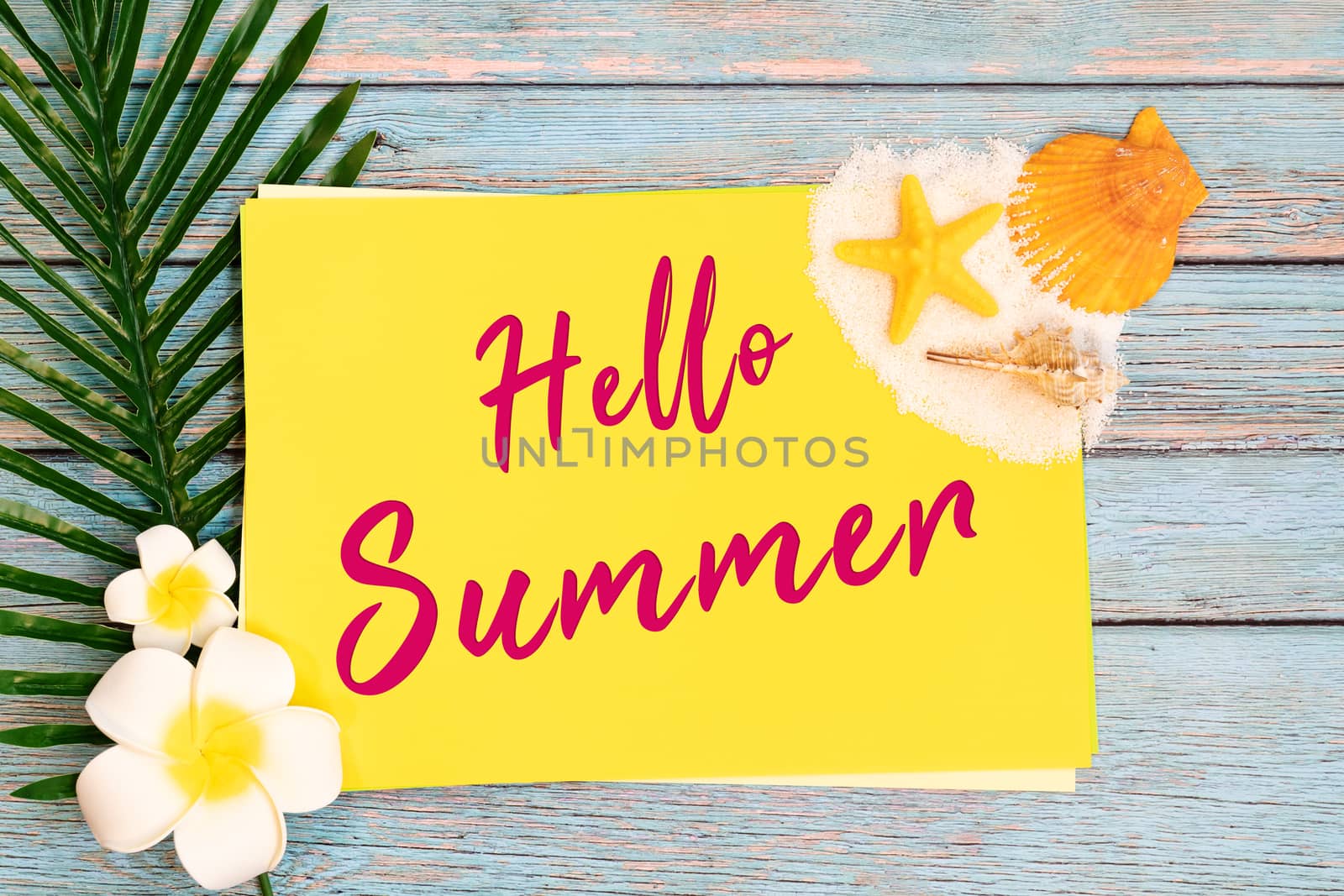 Beautiful summer holiday, Beach accessories, seashells, sand and palm leave on paper for copy space