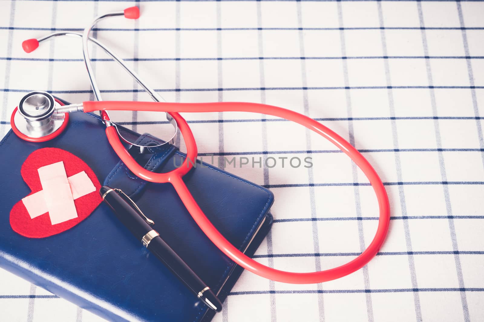 World health day healthcare and medical concept red stethoscope  by psodaz