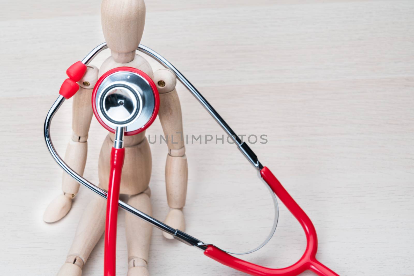 world health day healthcare and medicine stethoscope and wood man health check up healthy and insurance concept