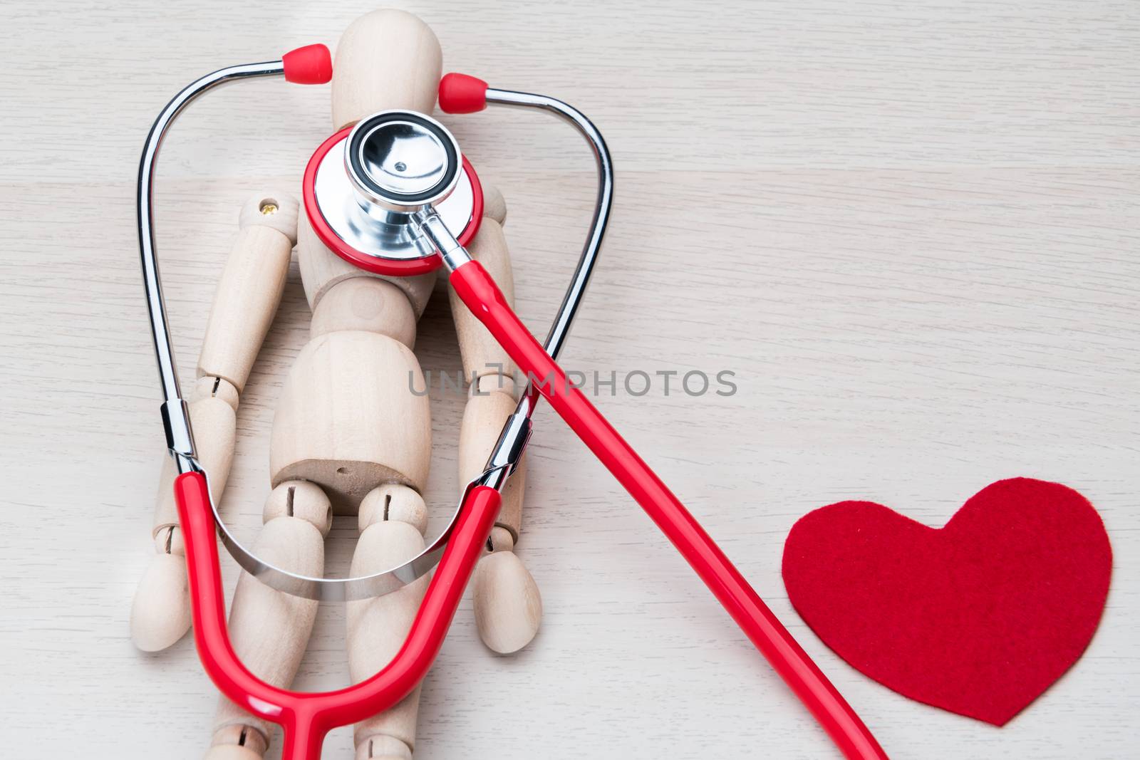 world health day healthcare and medicine stethoscope and wood man health check up healthy and insurance concept