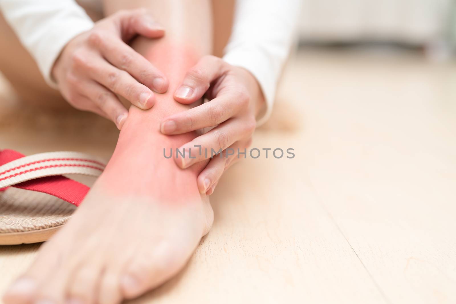 leg ankle injury painful women touching the leg painful with red highlight on injure. healthcare and medical concept